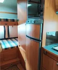 Camper mansardato adria coral 680 sk con portamoto